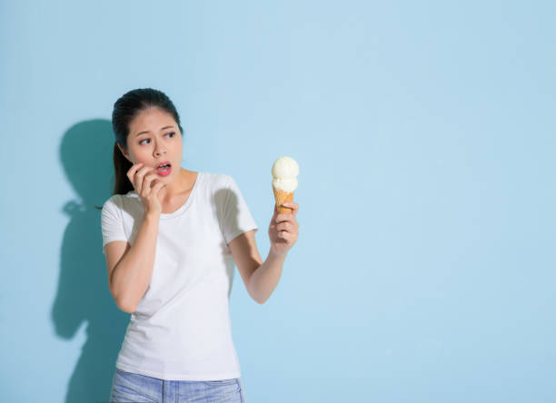 istock attractive lady looking at fresh milk ice cream 847188356