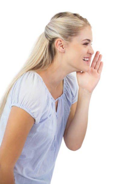 istock Smiling blonde woman telling a secret 847190102