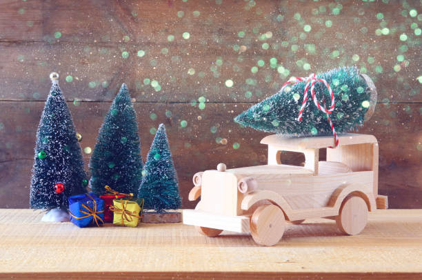 istock Wooden car carrying a christmas tree 847192002