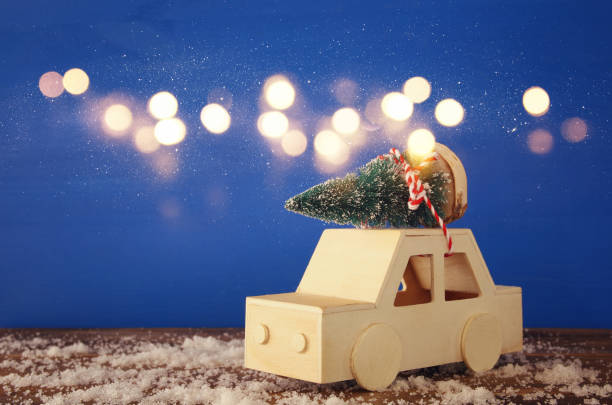 istock Wooden car carrying a christmas tree 847192068