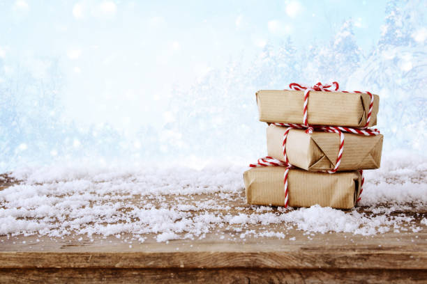 istock handmade gift boxes over snowy wooden table 847192226