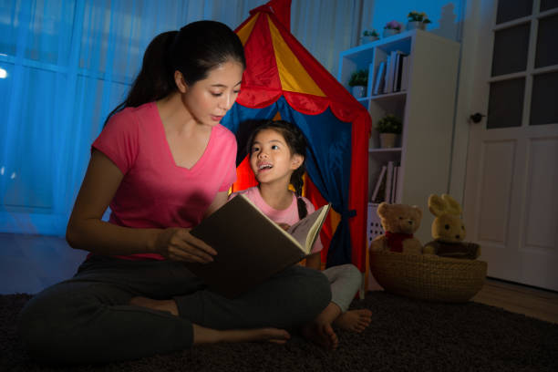 istock slim mother holding book speaking bedtime story 847197140