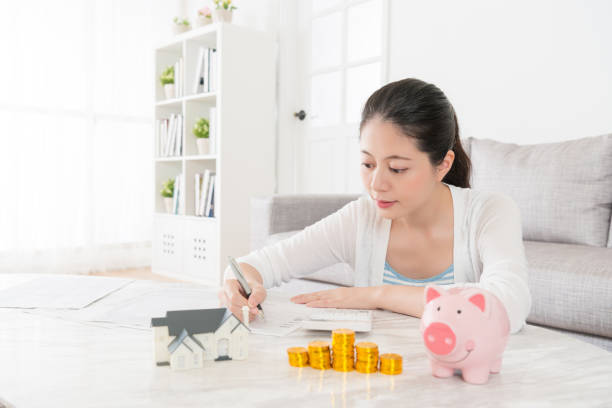 istock happiness woman writing all bill spending record 847197964