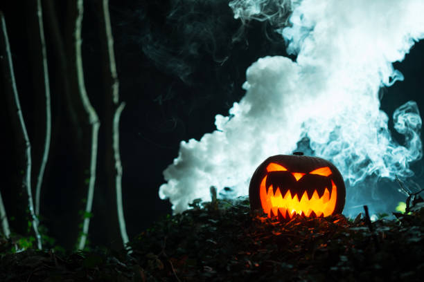 istock Glowing Jack-o-Lantern in Dark Woods with Smoking Background 847198740