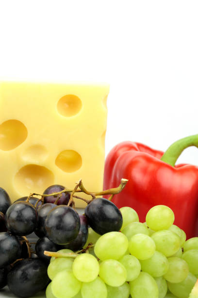 cheese, red pepper and grapes - cheese emmental cheese switzerland grated imagens e fotografias de stock