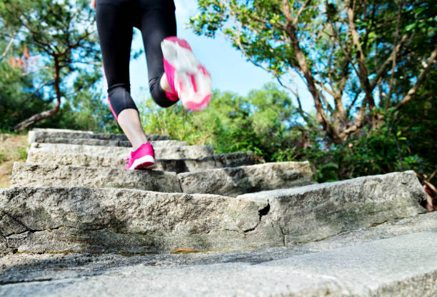 istock Woman feet walking on the steps 847202196