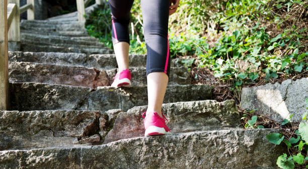 istock Woman feet walking on the steps 847202384