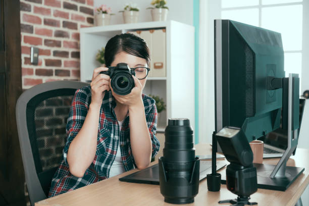 istock young female student holding professional camera 847203690