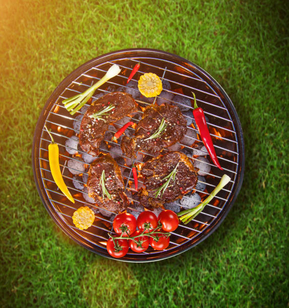 istock Barbecue grill with beef steaks, close-up 847207866