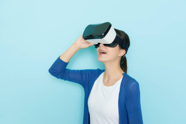 istock beautiful cheerful girl adjusting VR headset 847212816