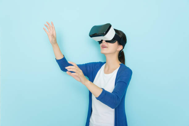 istock smiling young woman in virtual reality glasses 847212824