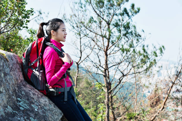 istock Woman backpacker resting at mountain peak 847213510