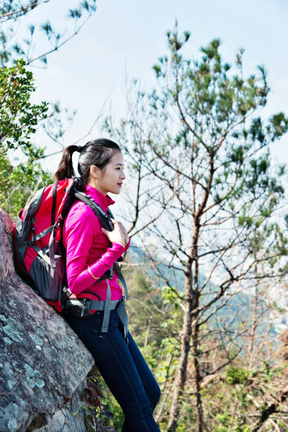 istock Woman backpacker resting at mountain peak 847213674