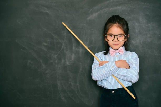 istock attractive little female teacher holding stick 847213806