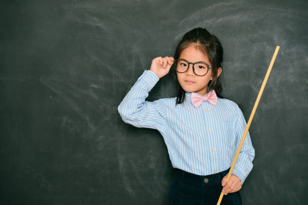 istock confident smart little girl dressed as teacher 847213912