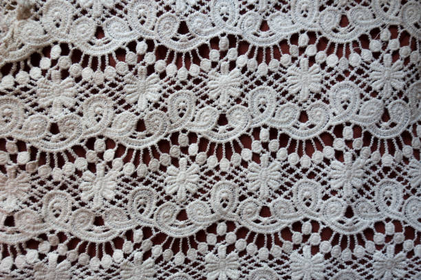 istock Retro styled white lacy fabric from above 847214280
