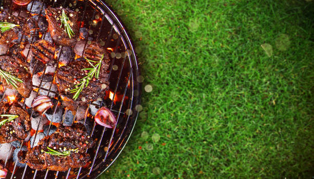 istock Barbecue grill with beef steaks, close-up 847214552