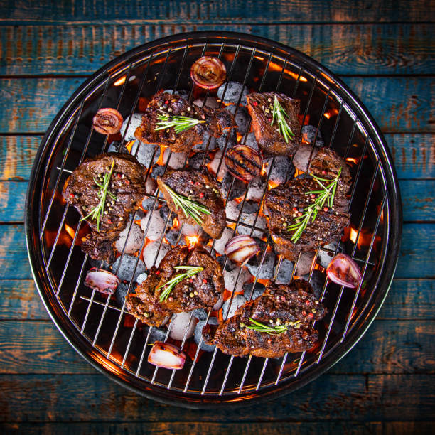 istock Barbecue grill with beef steaks, close-up 847217136