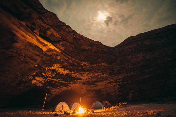 istock night camping under mountain on the full moon night 847217876