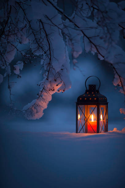 istock Candle lantern in the snow 847218084