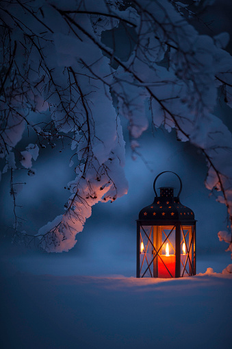 Candle lantern in the snow