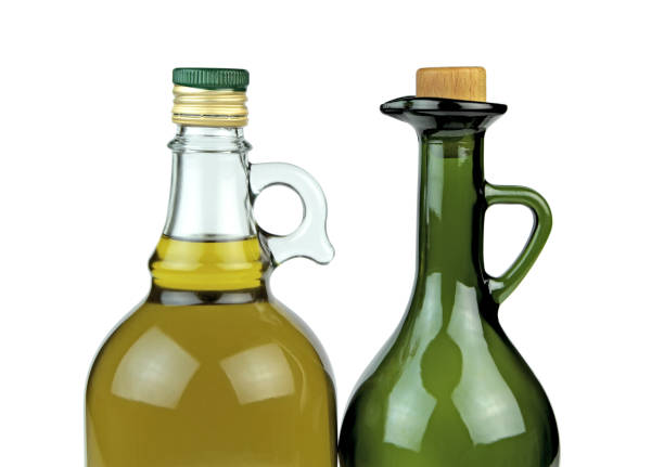 Simple empty green bottle on white background. Low depth of field. Copy space for your text. 