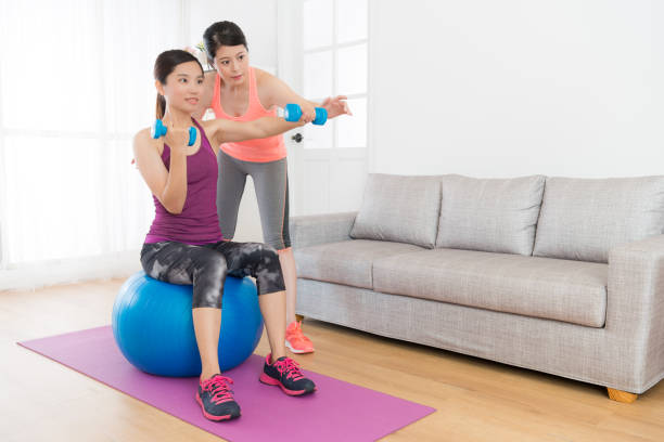 istock home fitness tutor woman teaching her student 847222982