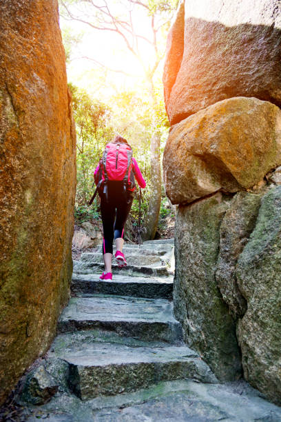 istock Woman walking by a narrow path 847225520