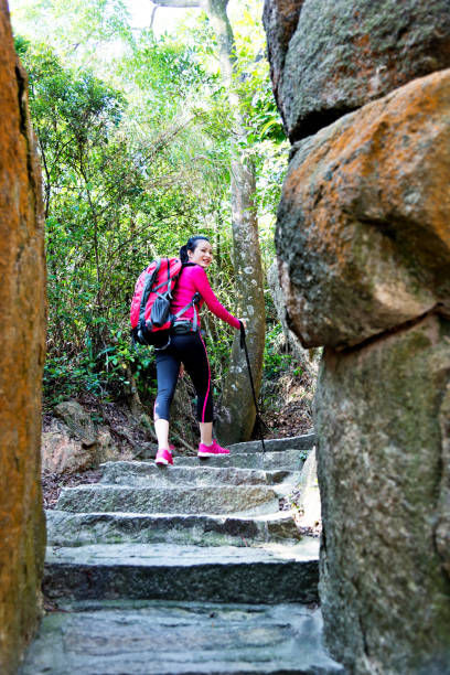 istock Woman walking by a narrow path 847225908