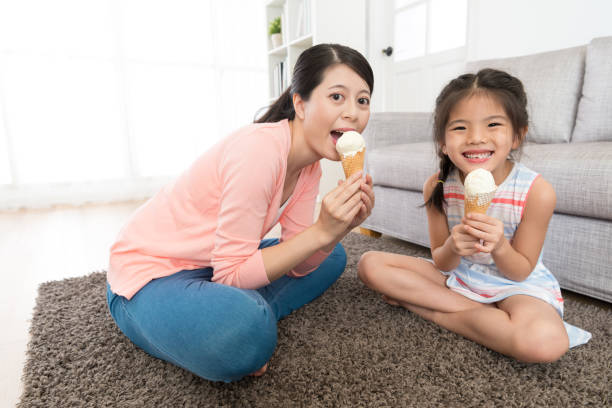 istock mom with her happy daughter relaxing on floor 847226990
