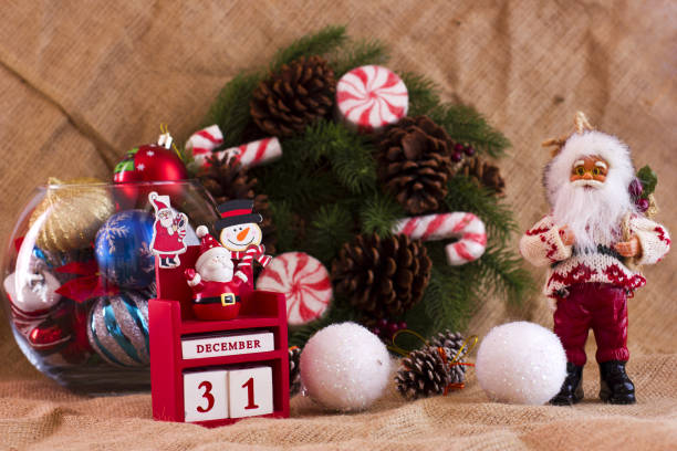 Christmas fir wreath with the cones and candies and a calender December 31