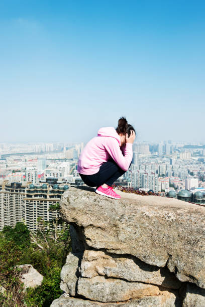 istock Woman at the edge of a cliff 847232148