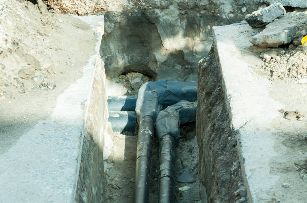 istock Elbow pipe of district heating underground pipeline system in the trench. 847232316