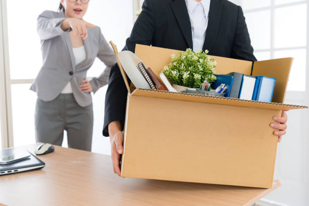 istock employee girl holding personal box ready to leave 847232896