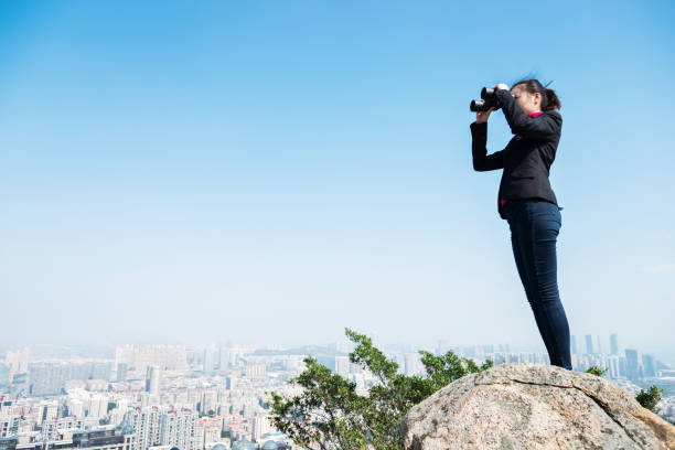 istock Businesswoman looking scenery with binocular 847233198