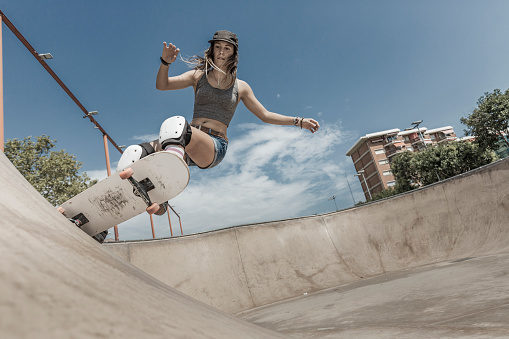 Young woman skateboarding in Barcelona Catalonia Spain