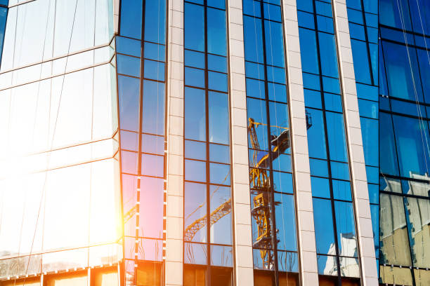 istock The crane was reflected on the wall of the building 847238308