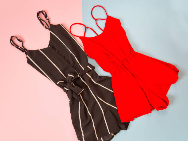 istock Black and red romper on pink-blue background. Fashionable concept 847249538