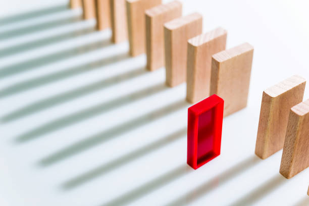 istock The red domino stands out 847252922
