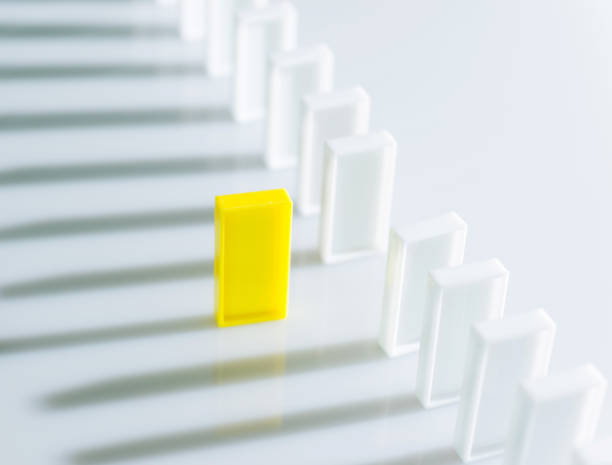 istock The yellow domino stands out 847252928