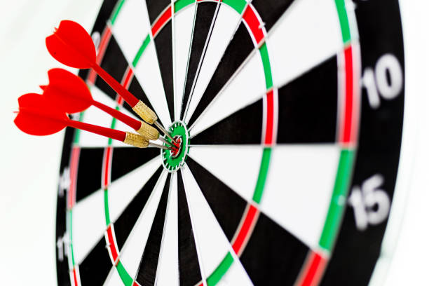 istock Three red darts arrows in the target center 847256878