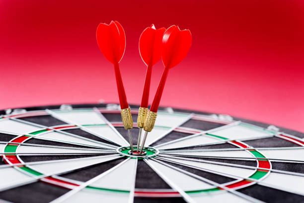 istock Hitting the bulls eye on the red background 847257004