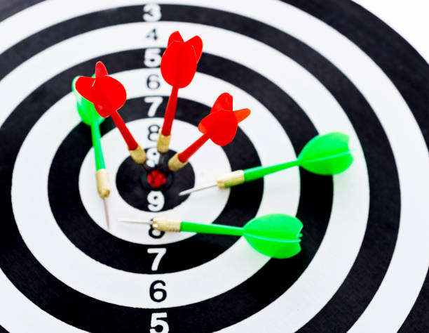 istock Red and green dart arrows on dartboard 847257504