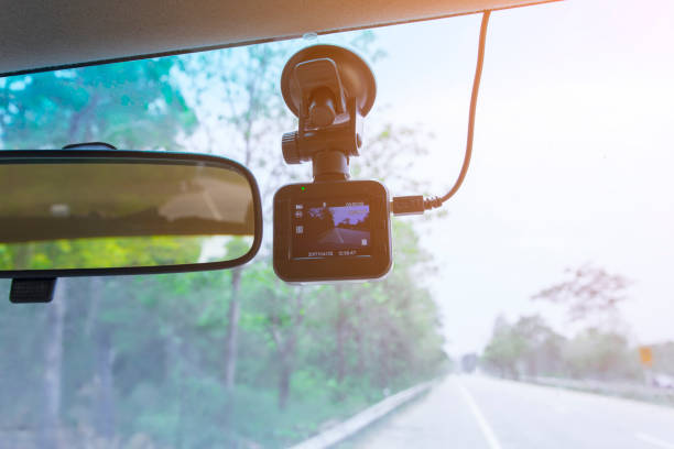 istock Car camera installed on wind shield of vehicle which can be truck or car of driver whose on the road trip or during traveling on the high way. The camera can be record the video for evidence accident. 847260960