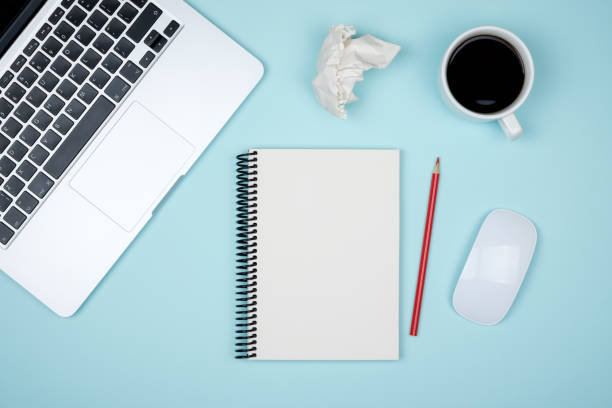 istock Minimal working desk with laptop and blank notepad page. Top view, flat lay and copy space 847261752