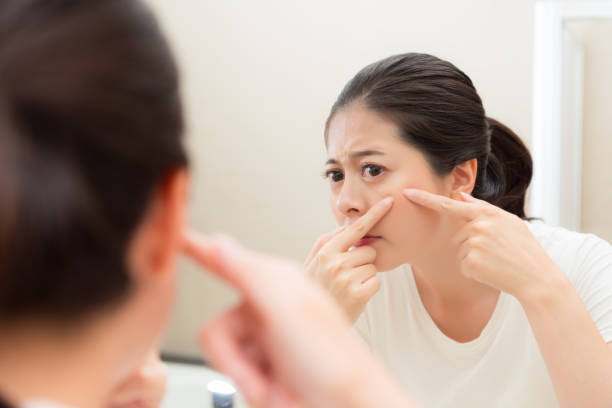 istock young sweet woman looking at bathroom mirror 847265102