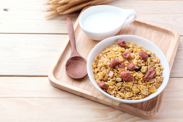 istock cornflakes and dry fruits on wooden background 847265920