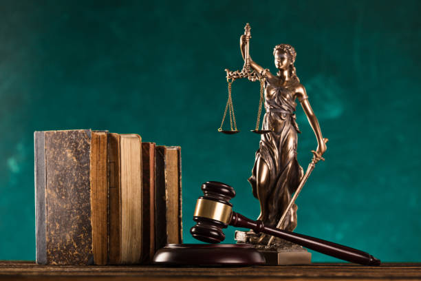 brown gavel with statue of justice