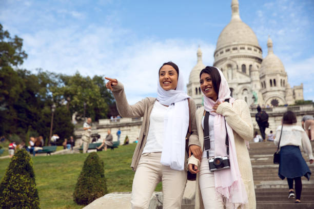 Arab youth in Paris - Middle eastern Millennials walking down the street of the capital of France.