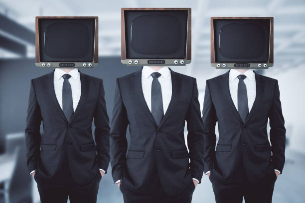 istock Obsolete TV headed businessmen 847277250